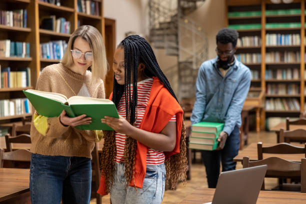 istock Students in the library getting prepared for the exams 2156494408