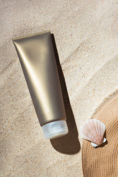 istock Sunscreen tube SPF with beach accessories on sand 2156494750