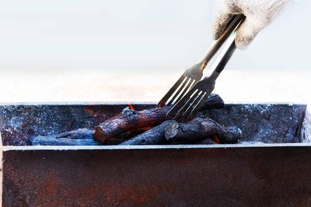 Beef steak on the grill with smoke and flames