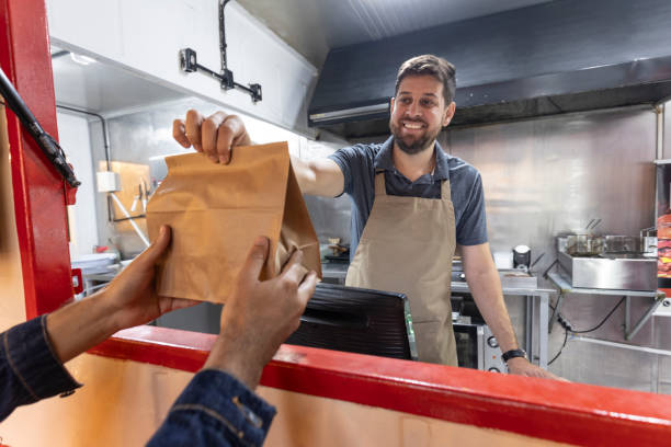 istock Caucasian man delivering packaged food 2156497259
