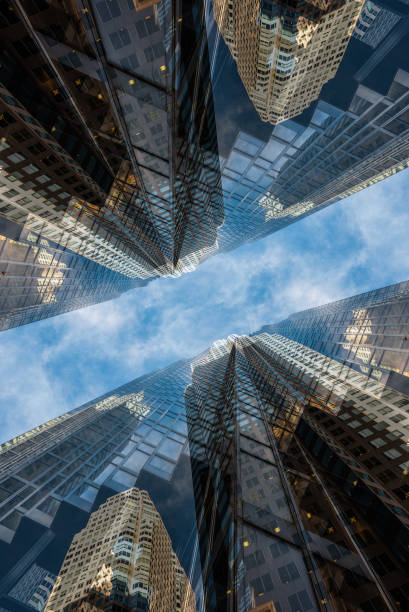istock symmetry and mirrored geometry pattern, reflected skyscrapers and modern buildings abstract background, lines and tunnel futuristic technology concept 2156497425