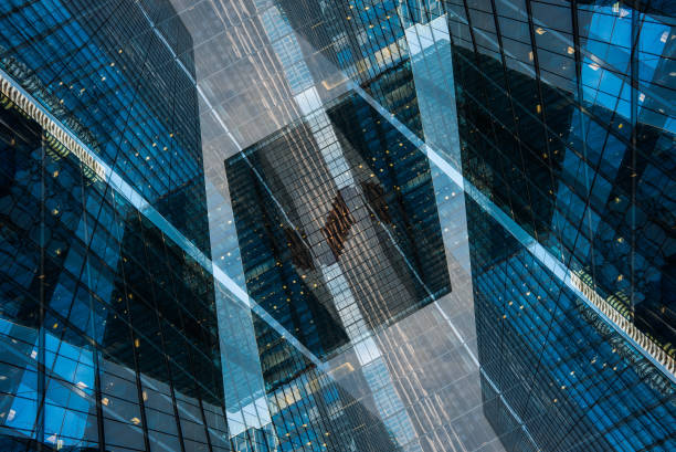 istock symmetry and mirrored geometry pattern, reflected skyscrapers and modern buildings abstract background, lines and tunnel futuristic technology concept 2156498237