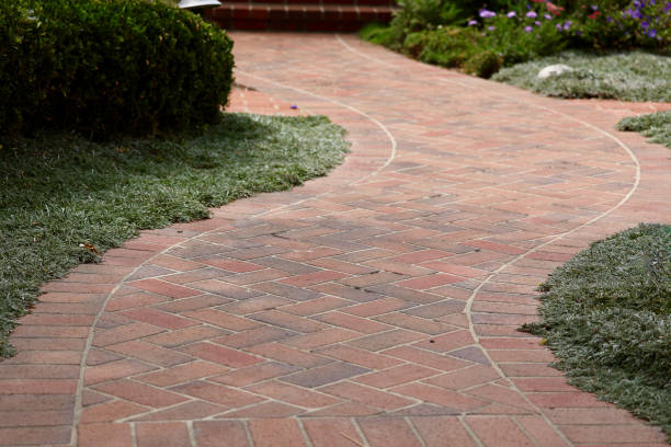 istock Curvy garden brick path in morning sun 2156500436