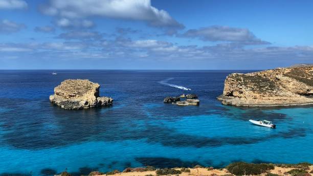 istock Comino Island Malta, Water scooters in between to rocks. Visiting caves in Comino 2156501336