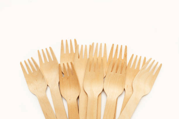 Wooden forks on a white background in a top view