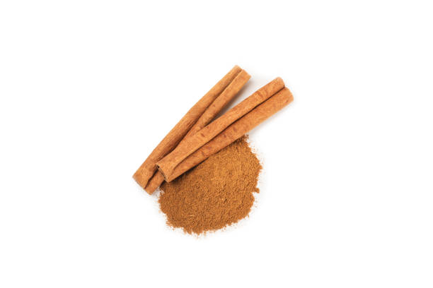 istock Cinnamon sticks on  background. Cinnamon roll. Spicy spice for baking, desserts and drinks. Fragrant ground cinnamon. cinnamon powder Close-up. Place for text. copy space 2156507181
