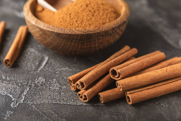 istock Cinnamon sticks on  background. Cinnamon roll. Spicy spice for baking, desserts and drinks. Fragrant ground cinnamon. cinnamon powder Close-up. Place for text. copy space 2156507366