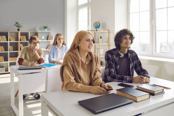 istock Young university or college students listen to an interesting lecture from a teacher. 2156509327