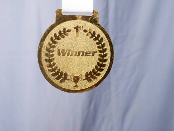 gold medal against yellow background