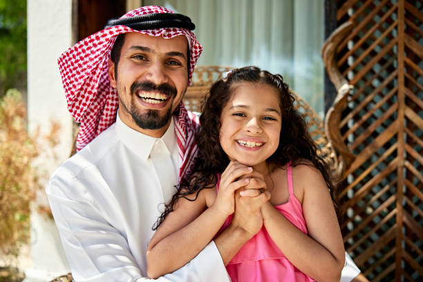 istock Cheerful Middle Eastern father and daughter outside villa 2156513628