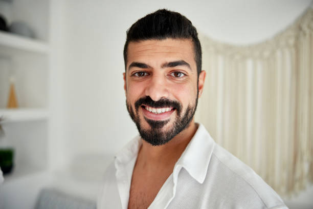 istock Smiling Saudi man in rental vacation villa 2156513662