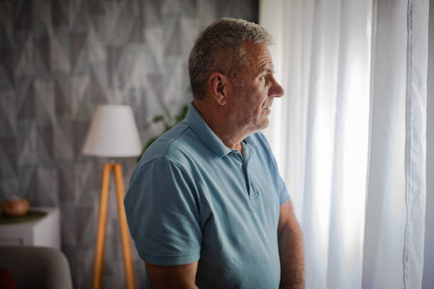 istock Emotions, a pensioner in a nursing home next to the window 2156514671