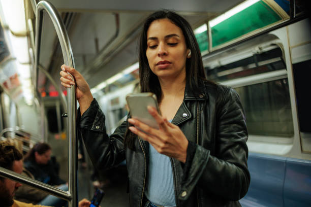 istock A young woman standing in a subway train 2156515709