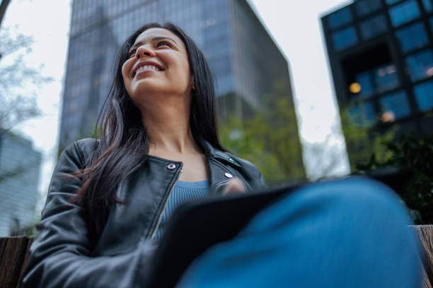 Girl with a pretty smile looking up while sitting