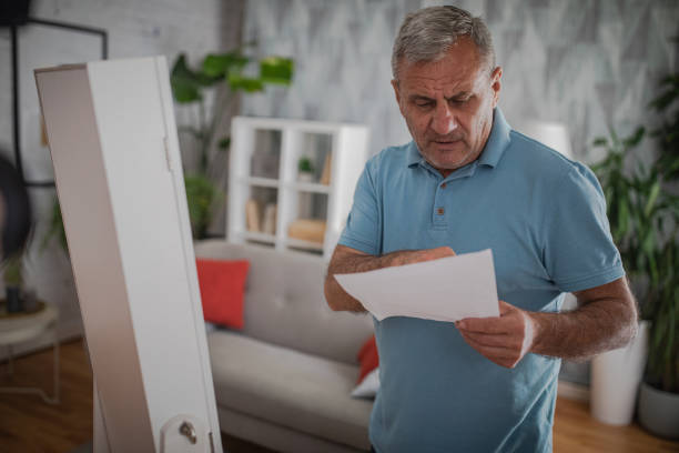 istock Elderly man in front of the mirror 2156517362