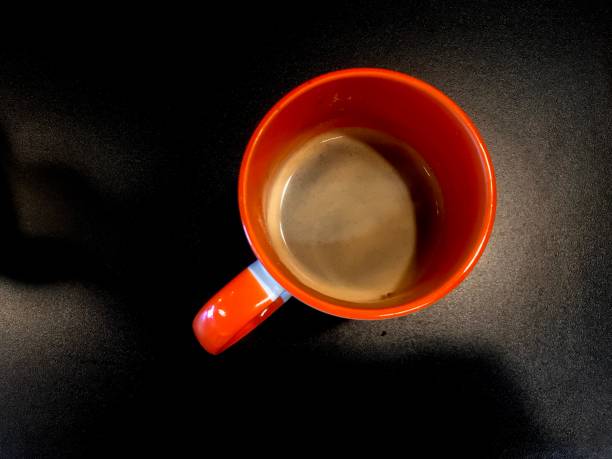Cup of coffee seen from above, coffee with technology, coffee in cup, coffee on white background, cup of coffee with keyboard, cup of coffee and digitalized table