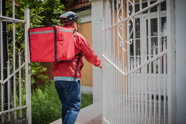 istock An elderly man works as a professional food delivery man 2156518118