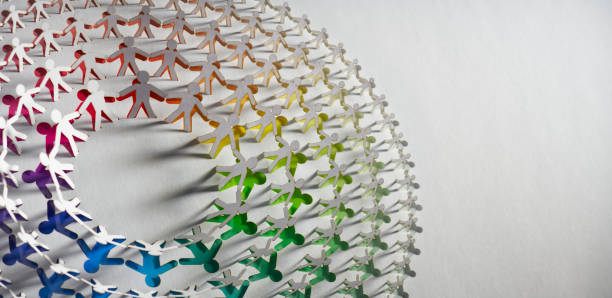 istock Intricate Paper Cut Artwork Depicting a Multicolored Array of Linked Human Figures in Circular Formation 2156520003