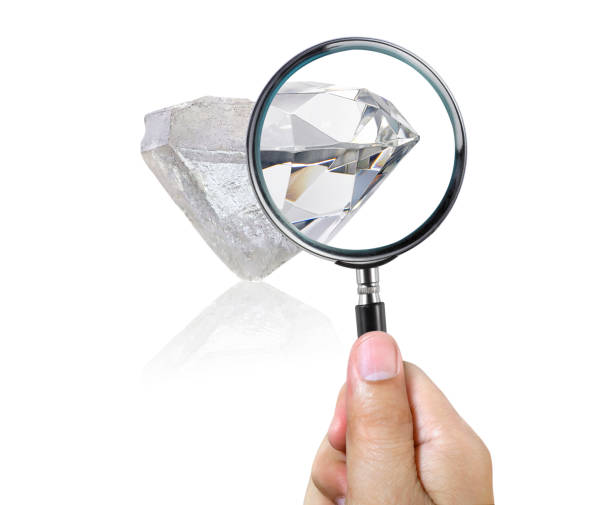 istock An expert examines through a magnifying glass. Searching For Value, diamond. transparent background. vector 2156520182