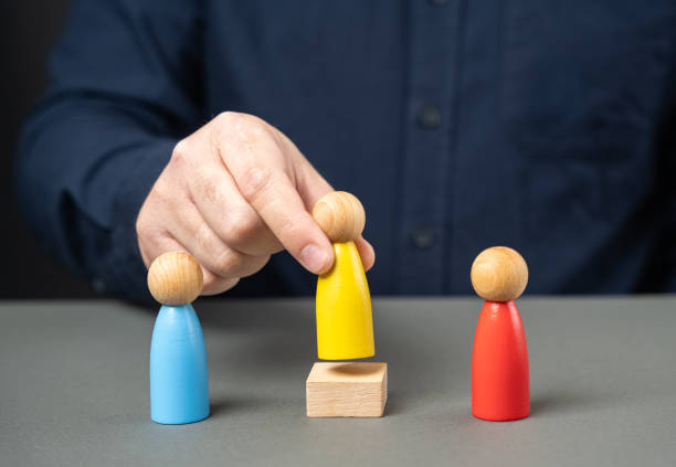 istock Appoint a mediator to resolve the dispute. Come to a consensus. Cooperation instead of competition. Mediation between sides. Reaching an agreement. Negotiating parties and arbitrator. 2156523018