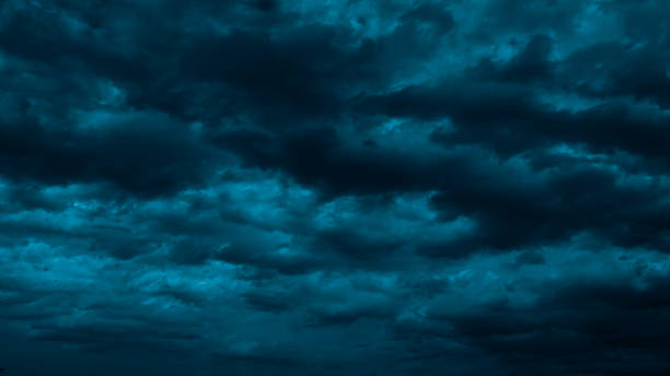 istock Night sky with clouds. Black dark petrol blue tone. Dramatic background. Storm thunder rain cloudy gloomy. 2156523915