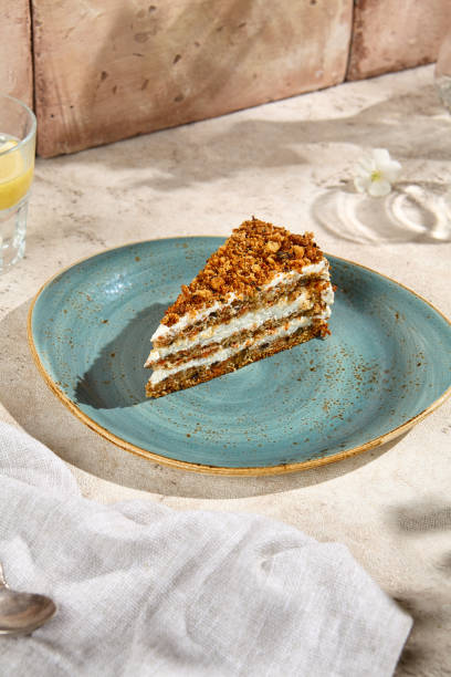istock Authentic Carrot Cake Slice on Rustic Table with Sunlight and Shadows - Still Life Photography 2156526900