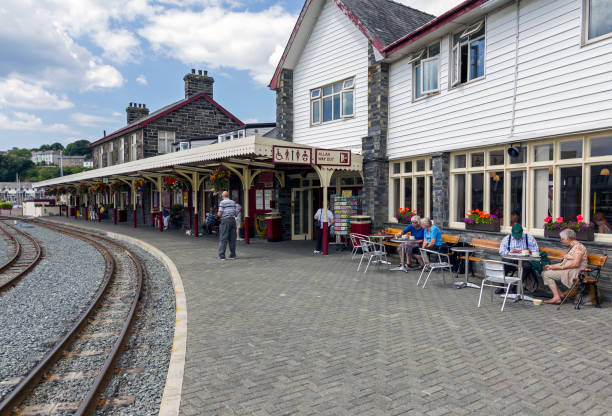 View across Porthmadog Railway Station, UK.  People can be seen on the station platform