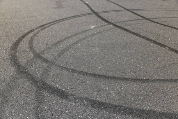 istock tire tracks during dangerous driving on the road 2156530925