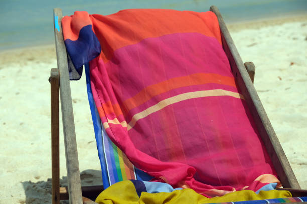 istock pareo on a beach chair on a sandy beach 2156533282