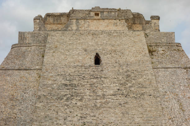 The Pyramid of the Magician at the ancient Mayan city of Uxmal in Yucatán, Mexico, known for its distinctive Puuc architectural style.