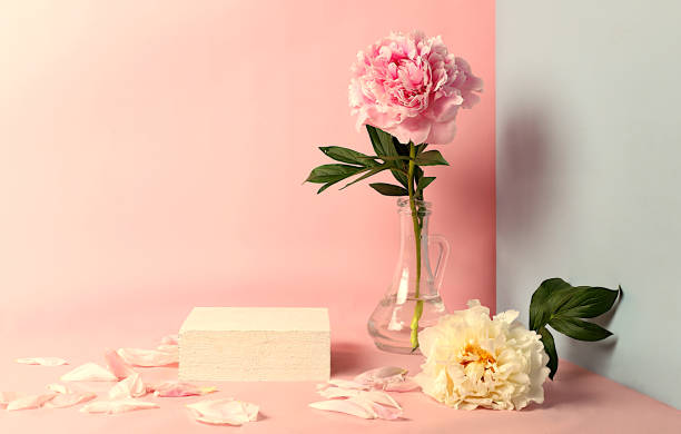 istock Minimal floral composition.Abstract background with empty podium and peonies flowers,empty showcase for display or presentation of cosmetic products,postcard with place for text, 2156538076