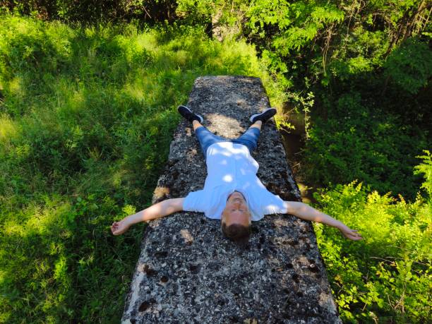 Man relaxing in nature, contemplate and clears his mind