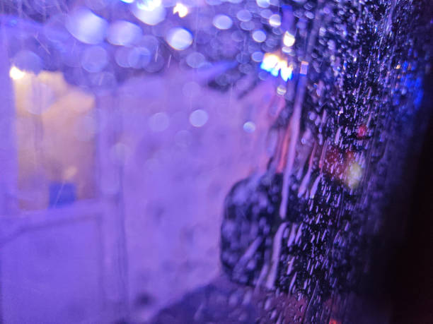 istock water drops on a car side window at night 2156546760