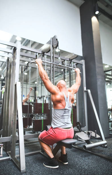 istock Strong man exercising in gym. Routine workout for physical and mental health. 2156548286