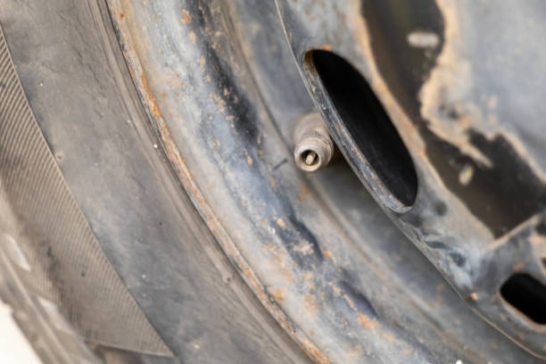 istock Precision Valve Detail Tire Maintenance CloseUp 2156550048