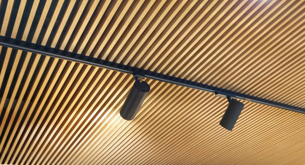 istock Modern lamella ceiling and black lamps. 2156551699