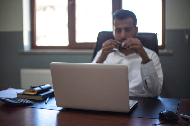 Young man with dwarfism working from home