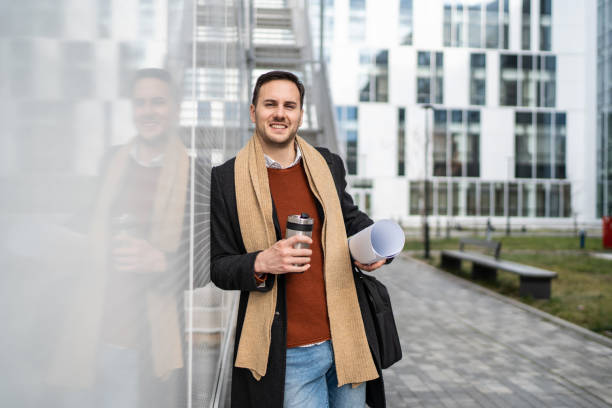 istock A young businessman carries his business projects and coffee 2156551936
