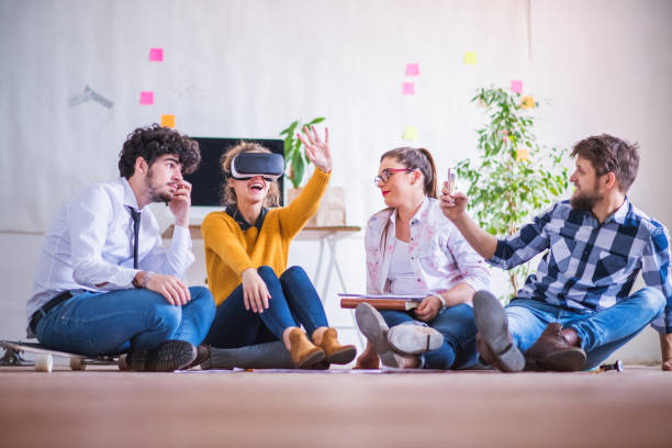 istock Young group of colleagues using VR technology in startup company office. Virtual reality in business. 2156552207
