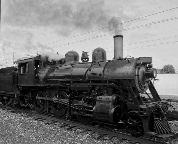 istock Old Steam Engine still running on railroad track 2156554254