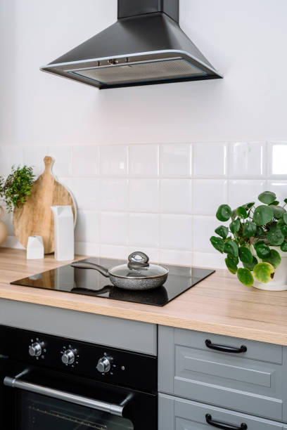 istock Modern kitchen with induction hob, electric oven and extractor hood 2156557329