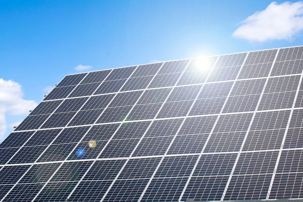 Close-up shot of blue solar panels, highlighting intricate textures and reflective surfaces
