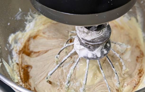 istock Cinnamon Cream Cheese Frosting in Mixer 2156560564