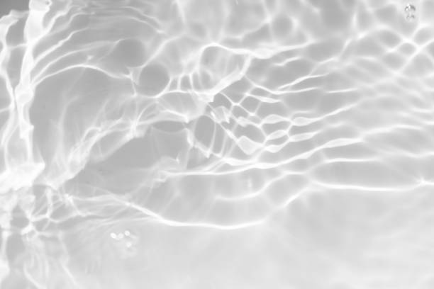 istock Blue water with ripples on the surface. Defocus blurred transparent blue colored clear calm water surface texture with splashes and bubbles. Water waves with shining pattern texture background. 2156561294
