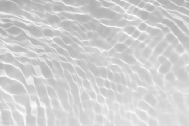 istock Blue water with ripples on the surface. Defocus blurred transparent blue colored clear calm water surface texture with splashes and bubbles. Water waves with shining pattern texture background. 2156561344