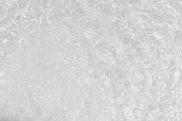 istock Blue water with ripples on the surface. Defocus blurred transparent blue colored clear calm water surface texture with splashes and bubbles. Water waves with shining pattern texture background. 2156561348