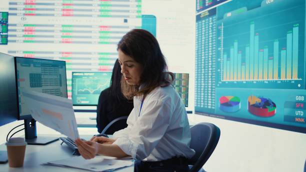 istock Enterprise worker examines project updates and details in control room 2156564610