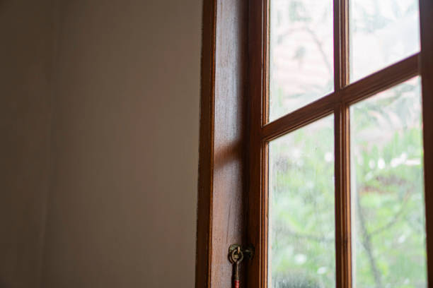 istock Wooden-framed window with greenery outside 2156567322