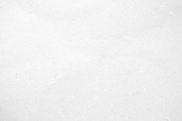 istock White recycled craft paper texture as background. Grey paper texture, Old vintage page or grunge vignette of old newspaper. Pattern rough art creased grunge letter. Hardboard with copy space for text. 2156569013