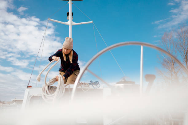 istock Sailor Woman Tidying Lines on a Boat 2156569973